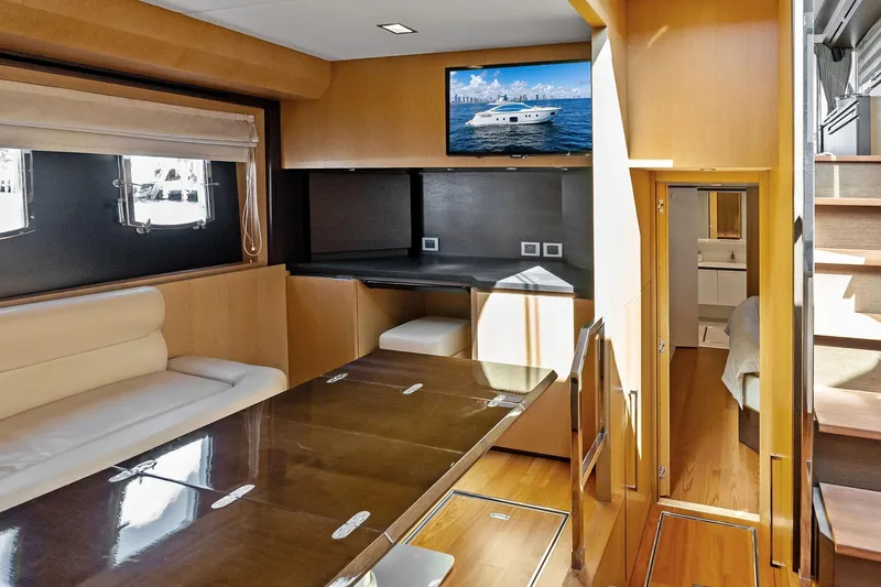 Blue Daksa Yacht Photos Pics Luxurious interior of 2013 Absolute 64 yacht with modern furnishings and a flat-screen TV.