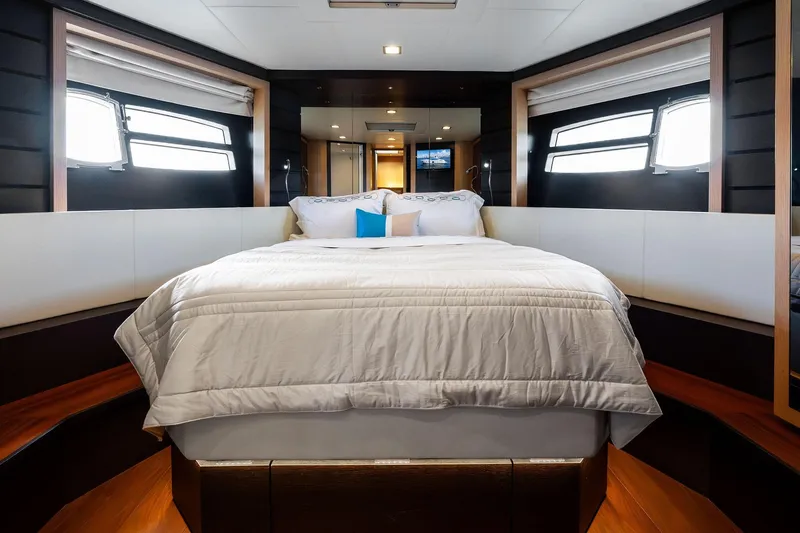 Blue Daksa Yacht Photos Pics Luxurious bedroom interior on a 2013 Absolute 64 yacht with elegant bedding and modern design.