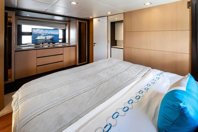 Blue Daksa Yacht Photos Pics Luxurious bedroom interior on a 2013 Absolute 64 yacht, featuring modern design and elegant decor.