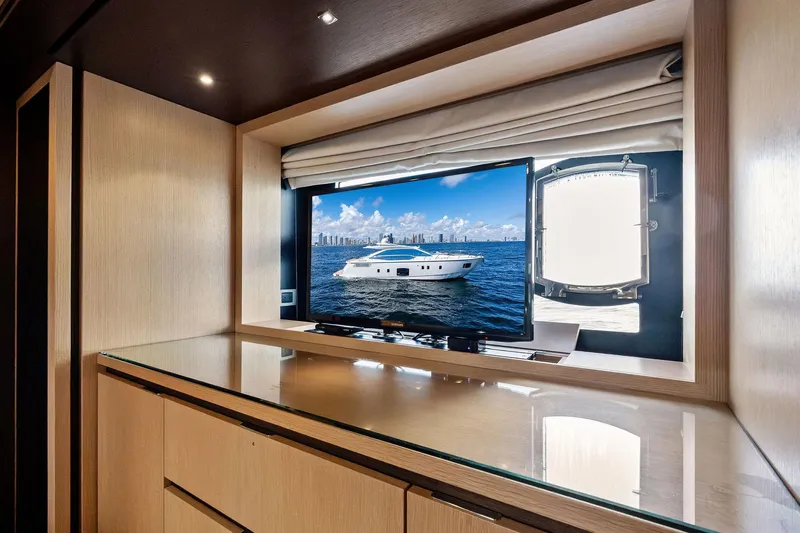 Blue Daksa Yacht Photos Pics Luxurious interior of 2013 Absolute 64 yacht with TV and ocean view.