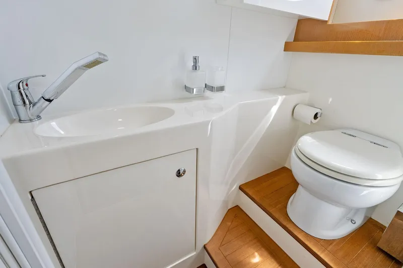 Blue Daksa Yacht Photos Pics Luxurious bathroom in 2013 Absolute 64 yacht with modern fixtures and wooden accents.