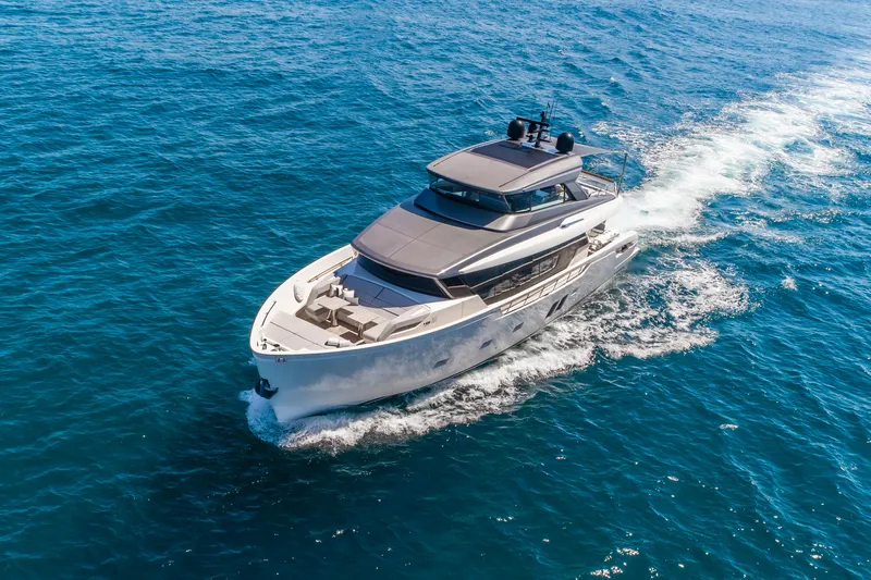 Violetta Yacht Photos Pics Sanlorenzo SX76 2021 yacht cruising on open blue sea, aerial view.