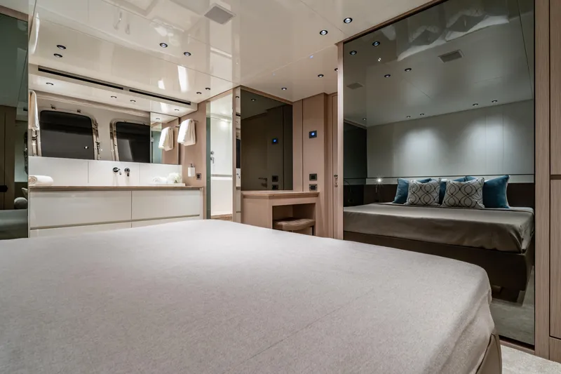 Violetta Yacht Photos Pics Luxurious interior of 2021 Sanlorenzo SX76 yacht bedroom with modern design and elegant furnishings.