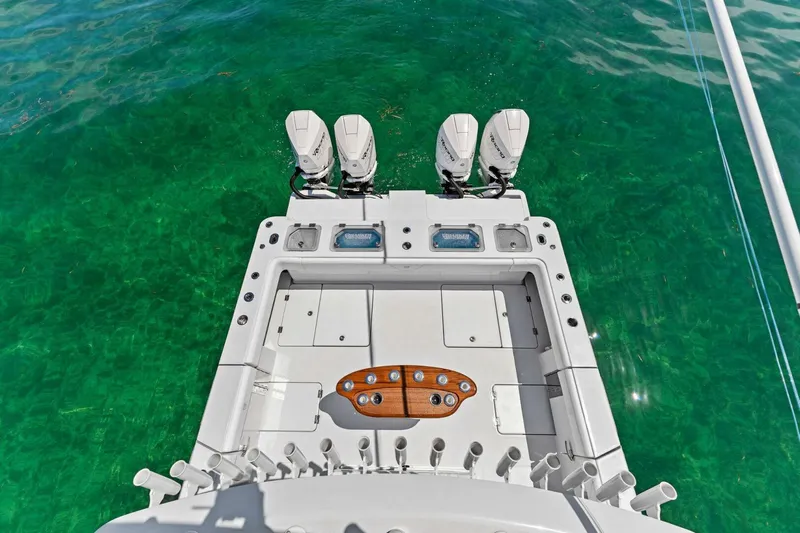  Yacht Photos Pics 2023 Barker Boatworks 40 HPC with triple outboard engines on clear water.