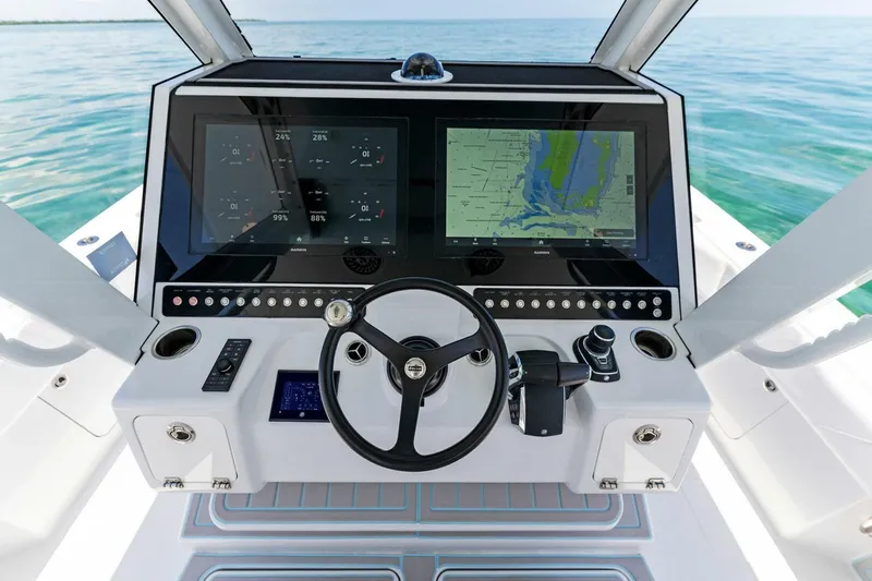  Yacht Photos Pics 2023 Barker Boatworks 40 HPC helm with dual displays and steering wheel.