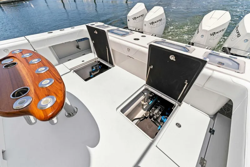  Yacht Photos Pics 2023 Barker Boatworks 40 HPC fishing deck with open storage compartments and multiple outboard engines.