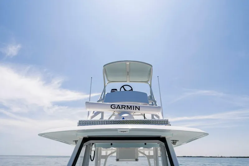  Yacht Photos Pics 2023 Barker Boatworks 40 HPC with Garmin navigation system under clear sky.