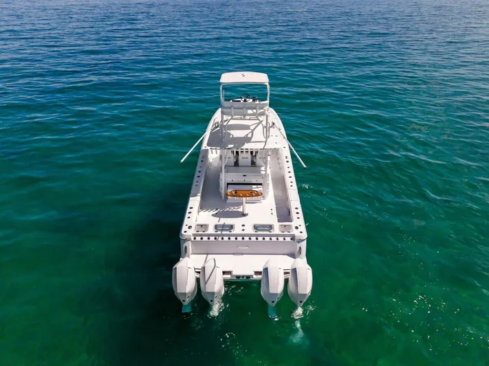  Yacht Photos Pics 2023 Barker Boatworks 40 HPC on open water, rear view.