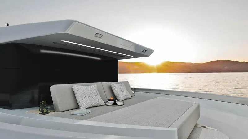  Yacht Photos Pics Luxurious 2026 Ladenstein L48 MIAMI yacht at sunset, featuring elegant outdoor seating.