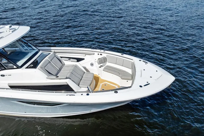 No Vacancy Yacht Photos Pics 2022 Pursuit S 428 Sport boat on water, featuring spacious seating and sleek design.