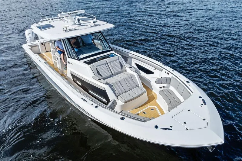 No Vacancy Yacht Photos Pics 2022 Pursuit S 428 Sport boat cruising on open water, featuring sleek design and spacious seating.