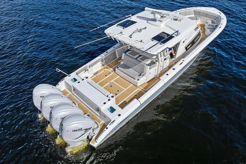 No Vacancy Yacht Photos Pics 2022 Pursuit S 428 Sport boat with four Yamaha engines on open water.