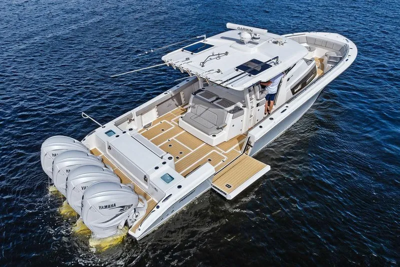 No Vacancy Yacht Photos Pics 2022 Pursuit S 428 Sport boat with four Yamaha engines on open water.