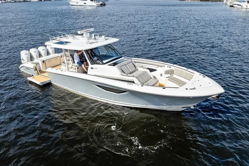 No Vacancy Yacht Photos Pics 2022 Pursuit S 428 Sport boat cruising on open water, featuring sleek design and powerful engines.