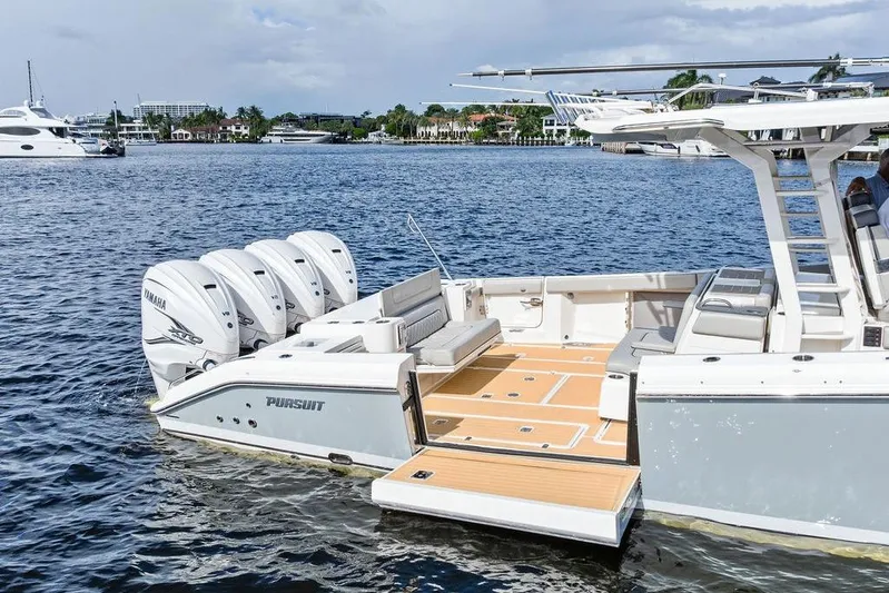 No Vacancy Yacht Photos Pics 2022 Pursuit S 428 Sport boat with Yamaha engines on a calm waterfront.