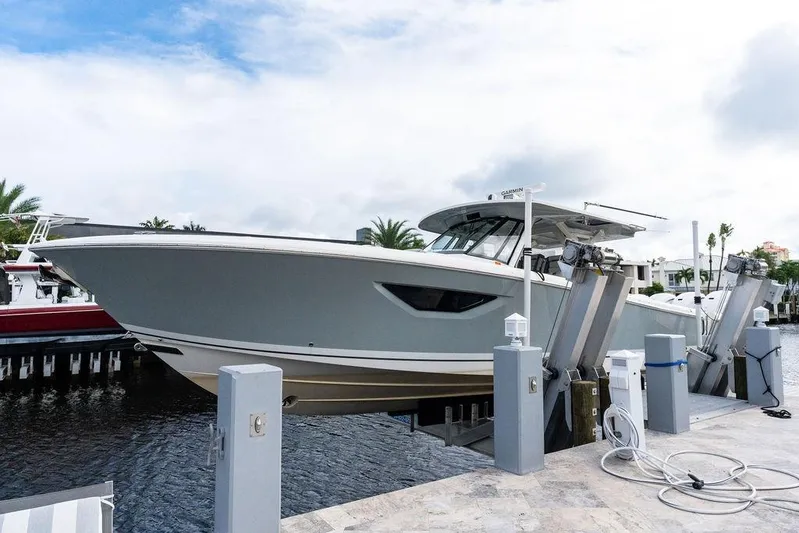 No Vacancy Yacht Photos Pics 2022 Pursuit S 428 Sport boat docked at marina, side view.