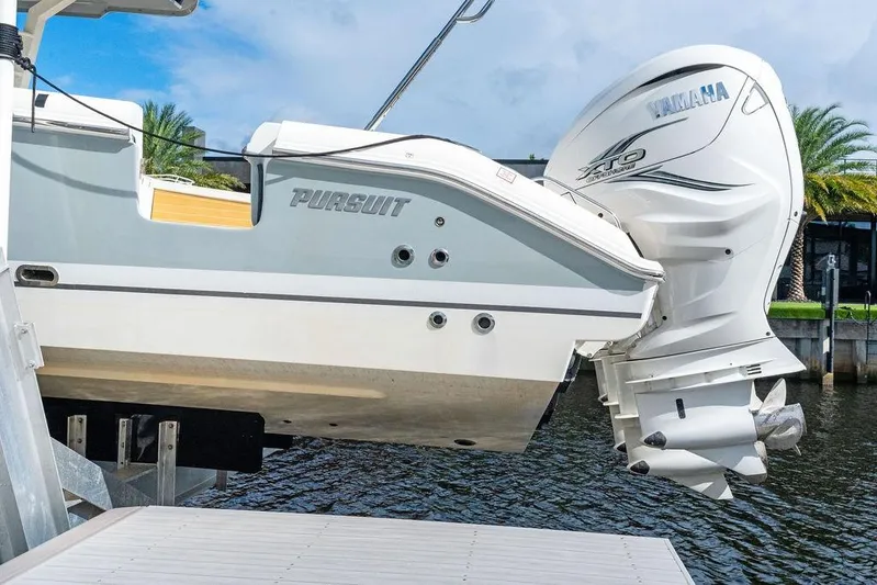 No Vacancy Yacht Photos Pics 2022 Pursuit S 428 Sport boat with Yamaha engine, docked by the water.