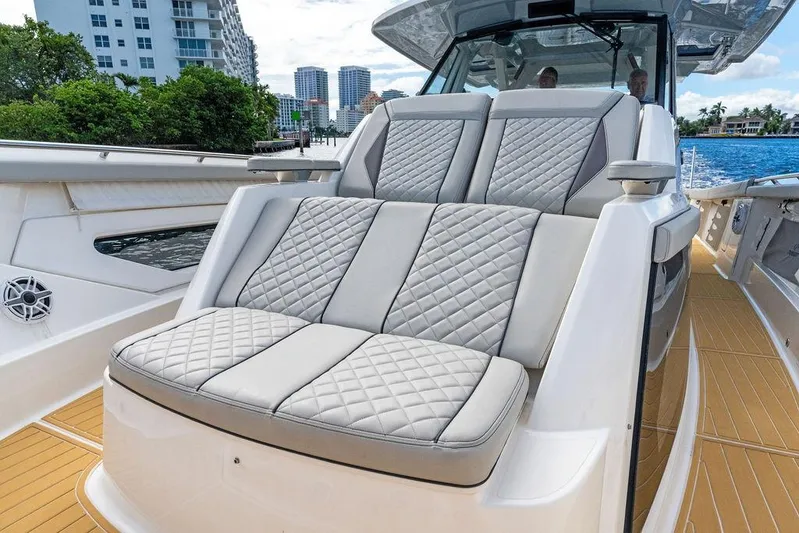 No Vacancy Yacht Photos Pics Luxurious seating on 2022 Pursuit S 428 Sport boat, featuring quilted upholstery and modern design.