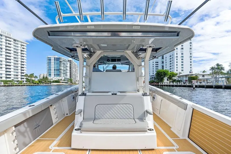 No Vacancy Yacht Photos Pics 2022 Pursuit S 428 Sport boat on water, modern design, cityscape background.