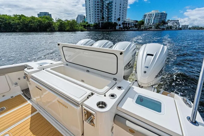 No Vacancy Yacht Photos Pics 2022 Pursuit S 428 Sport boat with powerful engines on a scenic waterway.