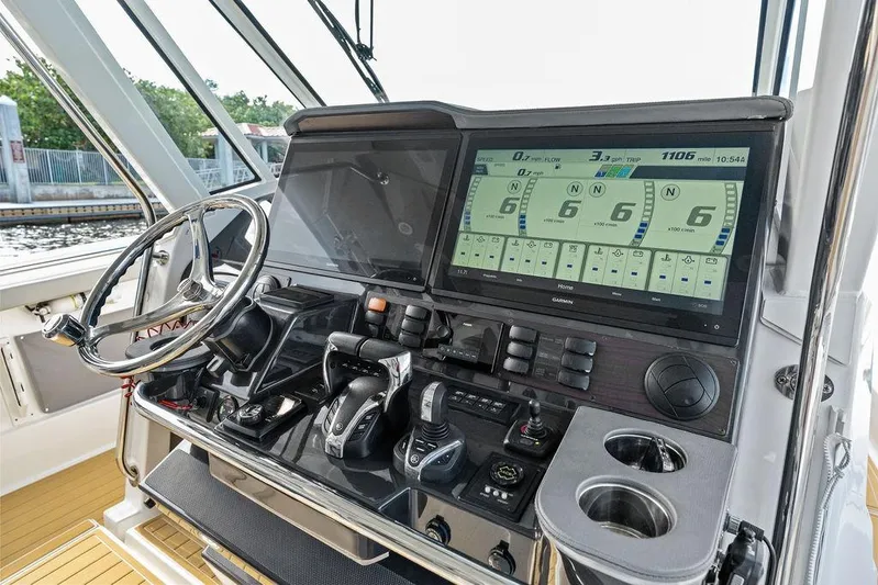 No Vacancy Yacht Photos Pics 2022 Pursuit S 428 Sport boat dashboard with advanced controls and navigation display.
