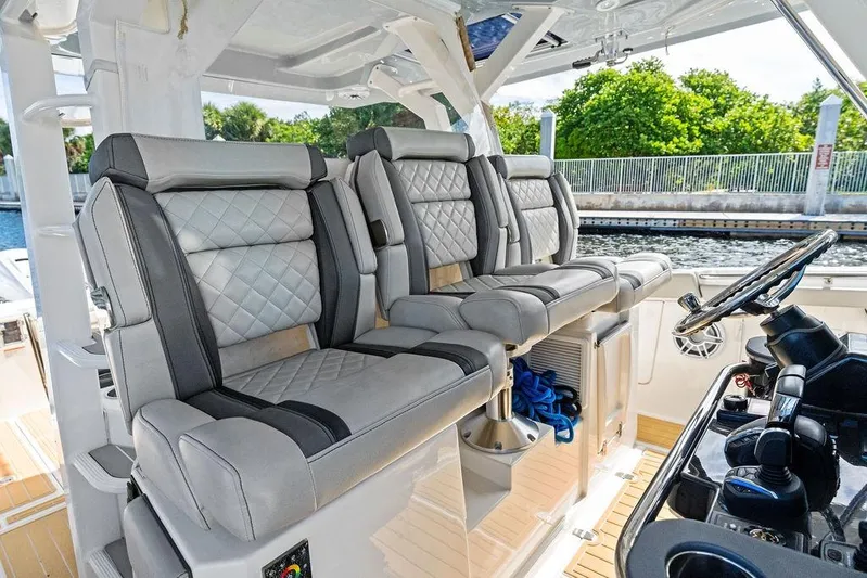No Vacancy Yacht Photos Pics Luxurious seating on 2022 Pursuit S 428 Sport boat, featuring plush, quilted upholstery.