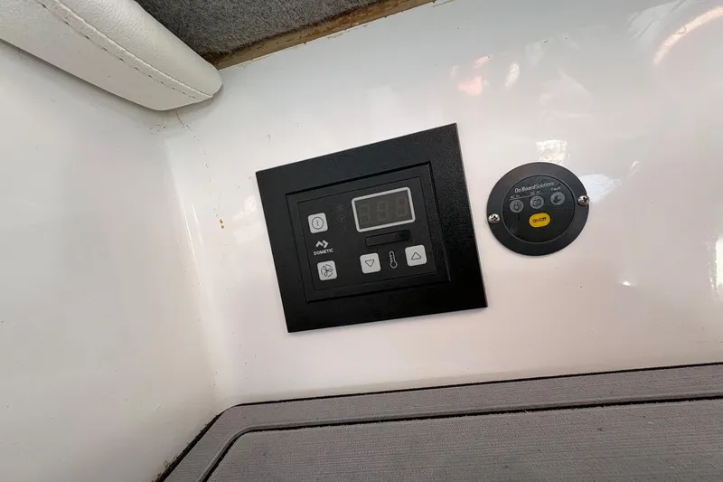  Yacht Photos Pics Control panel on 2023 Nor-Tech 390 Sport Center Console boat interior.