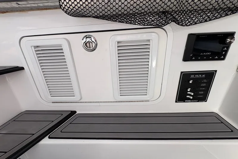  Yacht Photos Pics 2023 Nor-Tech 390 Sport Center Console dashboard with JL Audio system and control panel.