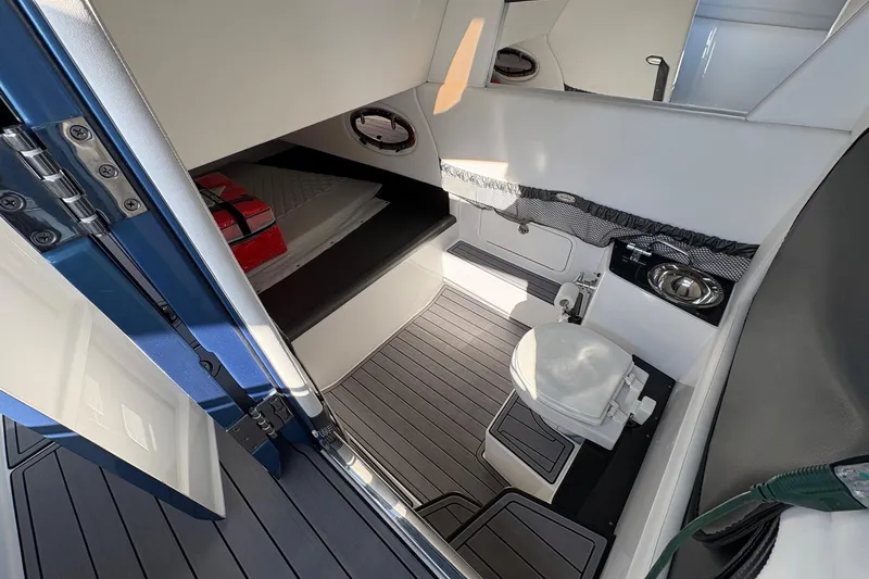  Yacht Photos Pics 2023 Nor-Tech 390 Sport Center Console cabin interior with toilet and sink.