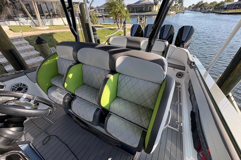  Yacht Photos Pics 2023 Nor-Tech 390 Sport Center Console with stylish seating and modern design by the water.
