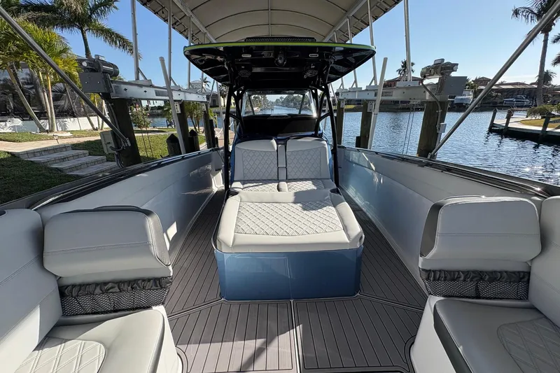  Yacht Photos Pics 2023 Nor-Tech 390 Sport Center Console boat interior with luxurious seating and waterfront view.