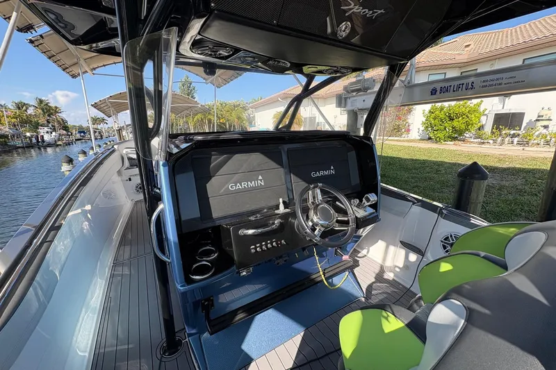  Yacht Photos Pics 2023 Nor-Tech 390 Sport Center Console boat interior with Garmin navigation system.