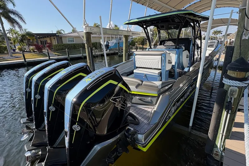  Yacht Photos Pics 2023 Nor-Tech 390 Sport Center Console boat docked with multiple outboard engines.