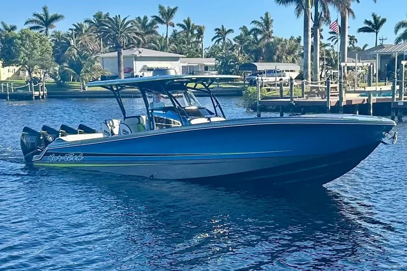  Yacht Photos Pics 2023 Nor-Tech 390 Sport Center Console boat on a sunny waterfront.