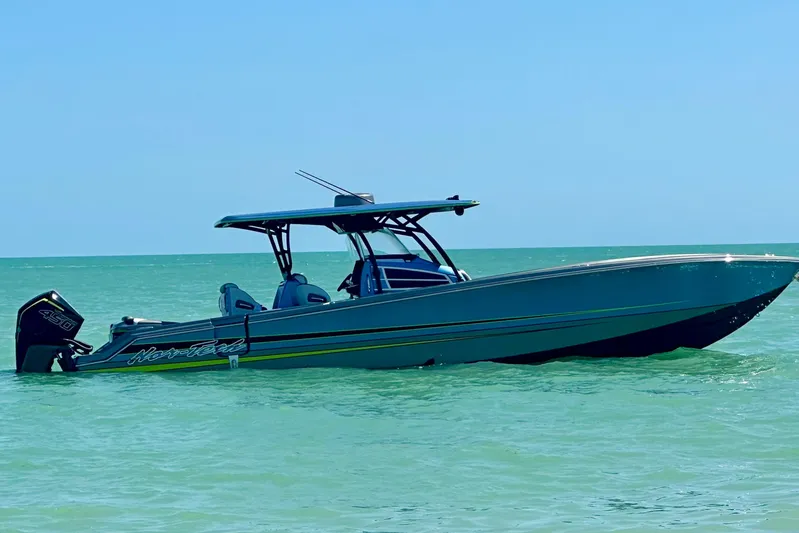  Yacht Photos Pics 2023 Nor-Tech 390 Sport Center Console boat on calm turquoise water.