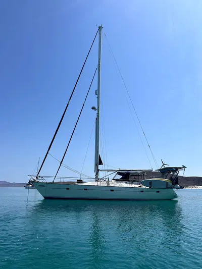 Sarama Yacht Photos Pics Sailboat "Ancosta Dubois" 1988 model on calm blue water under clear sky.