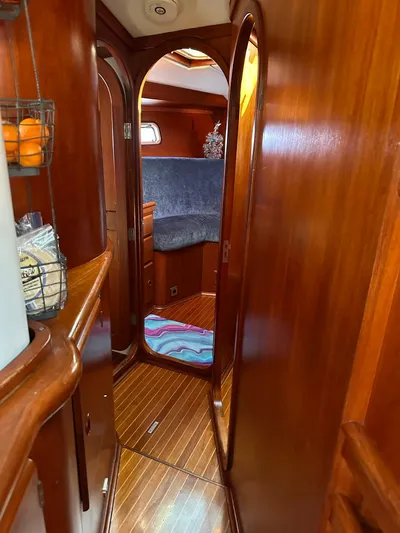 Sarama Yacht Photos Pics Interior of 1988 Custom Ancosta Dubois yacht with wooden finish and cozy cabin space.