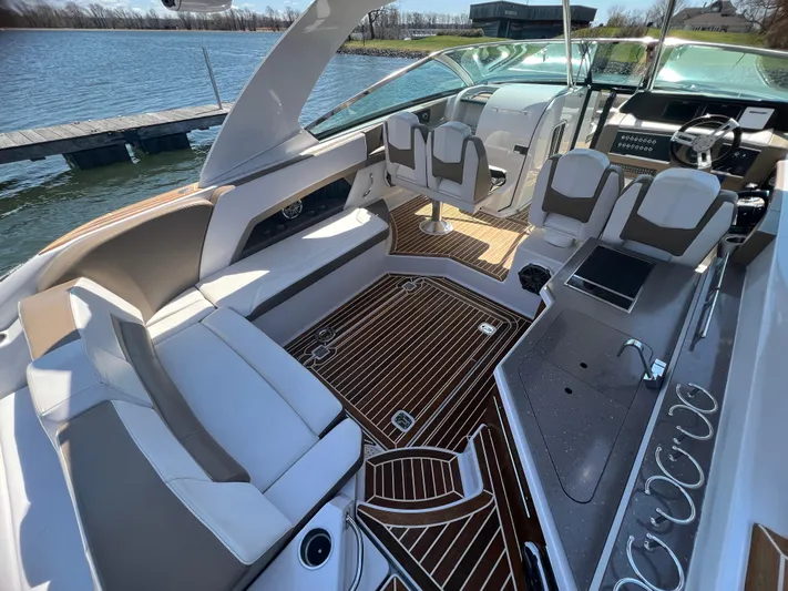  Yacht Photos Pics Luxurious 2015 Four Winns H350 boat interior with elegant seating and wood flooring.