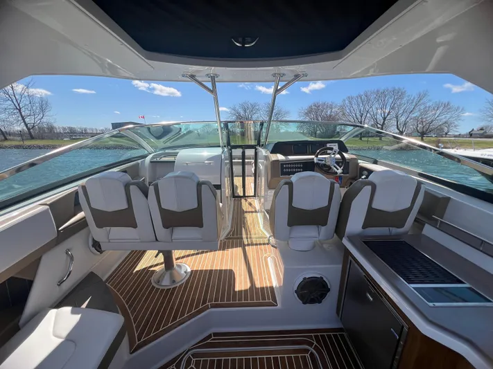  Yacht Photos Pics Interior of 2015 Four Winns H350 boat with modern seating and wood flooring.