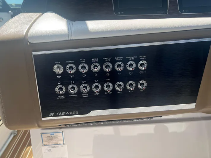  Yacht Photos Pics Control panel of 2015 Four Winns H350 boat with labeled switches and dials.