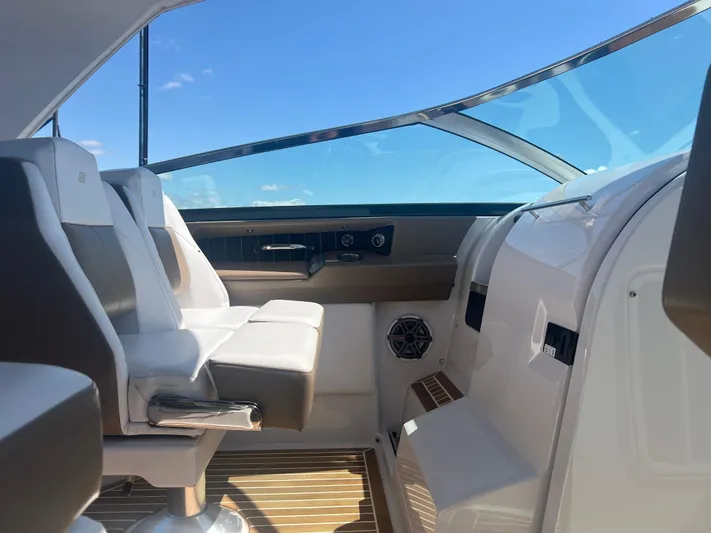  Yacht Photos Pics Interior of 2015 Four Winns H350 boat with modern seating and clear blue sky view.