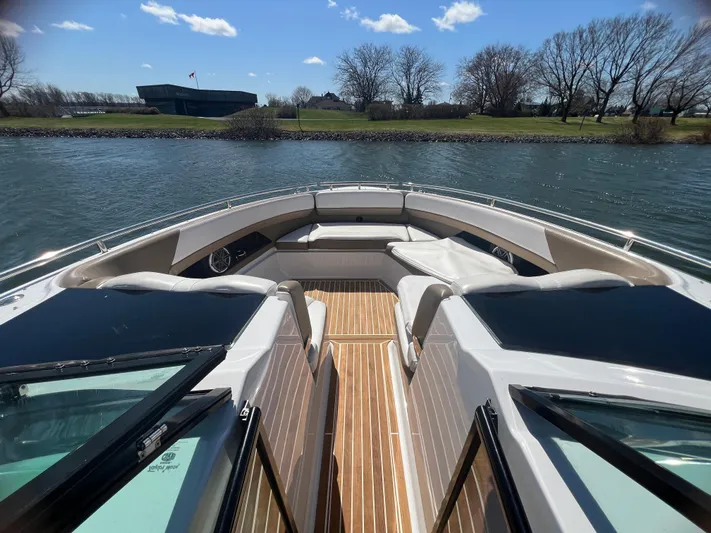  Yacht Photos Pics 2015 Four Winns H350 boat interior with seating, on a sunny day by the water.