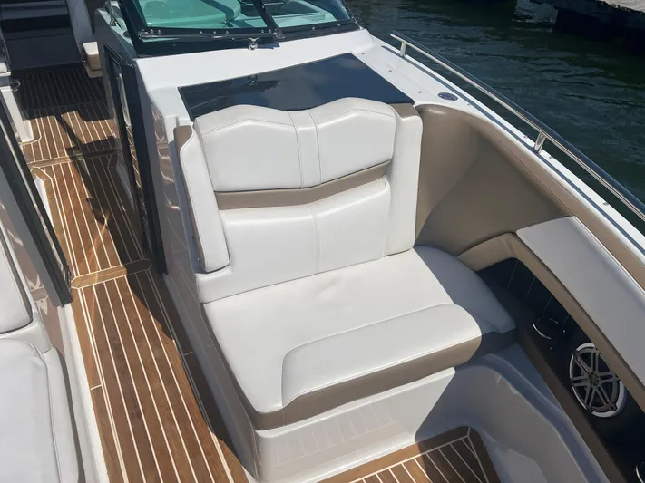  Yacht Photos Pics 2015 Four Winns H350 boat interior with white seating and wood flooring.