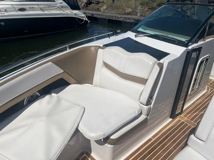  Yacht Photos Pics 2015 Four Winns H350 boat interior with white seating and wooden deck.
