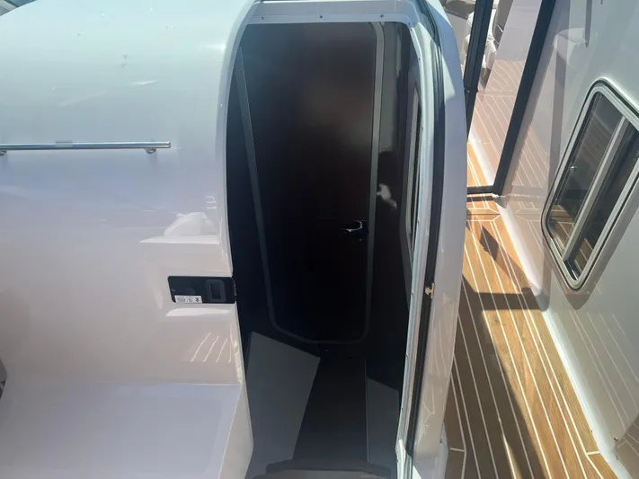  Yacht Photos Pics 2015 Four Winns H350 boat interior entrance with wooden deck and sleek design.