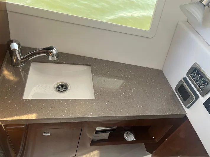  Yacht Photos Pics 2015 Four Winns H350 boat interior with sink and countertop.