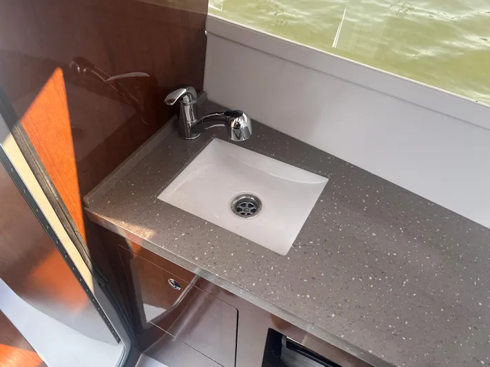  Yacht Photos Pics 2015 Four Winns H350 boat interior with modern sink and countertop.