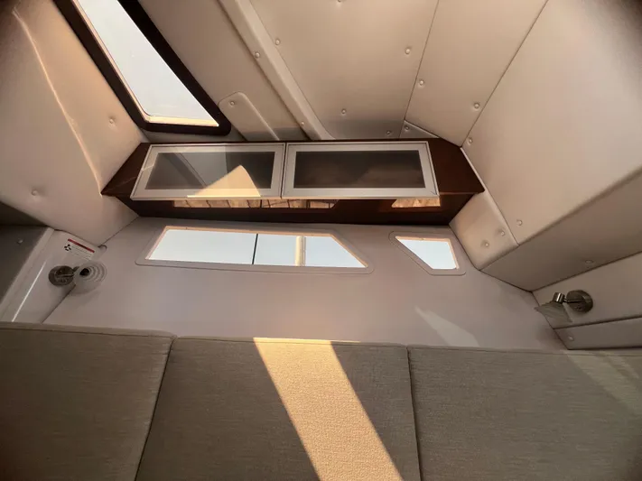  Yacht Photos Pics Interior cabin view of 2015 Four Winns H350 boat with windows and seating.