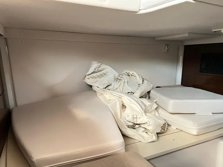  Yacht Photos Pics Interior cabin storage of 2015 Four Winns H350 boat with cushions and fabric.