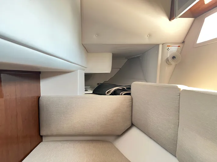  Yacht Photos Pics Interior cabin of 2015 Four Winns H350 boat with beige seating and wooden accents.